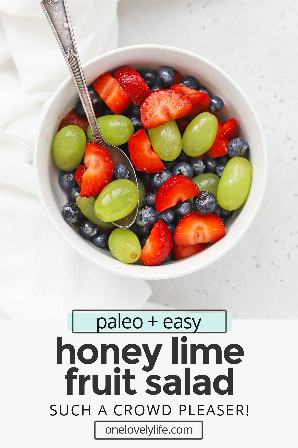 Honey Lime Fruit Salad is my favorite side dish. It's perfect for weeknight dinners, baby or wedding showers, barbecues, and more! // honey lime fruit salad recipe // healthy fruit salad // paleo fruit salad // fruit salad recipe // honey lime dressing #fruitsalad #honeylime #potluck #picnic #barbecue #sidedish #brunch #paleo