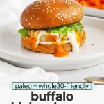 Front view of a buffalo chicken burger on a gluten-free bun with lettuce, buffalo sauce, and paleo ranch with text overlay that reads "paleo + whole30-friendly buffalo chicken burgers: quick + easy + healthy"