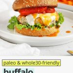 Front view of a buffalo chicken burger on a gluten-free bun with lettuce, tomato, buffalo sauce, and paleo ranch with text overlay that reads "paleo + whole30-friendly buffalo chicken burgers: quick + easy + healthy"