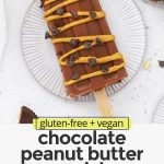 Overhead view of healthy chocolate peanut butter popsicles drizzled with peanut butter & chocolate
