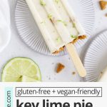 Overhead view of healthy key lime pie popsicles garnished with graham cracker crumbs and lime zest on a white background with text overlay that reads "gluten-free + vegan-friendly key lime pie popsicles: creamy + fresh + sweet + tart"