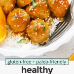 Overhead view of healthy orange chicken meatballs with rice and steamed broccoli with text overlay that reads "gluten-free + paleo-friendly healthy orange chicken meatballs with the most amazing sauce!"