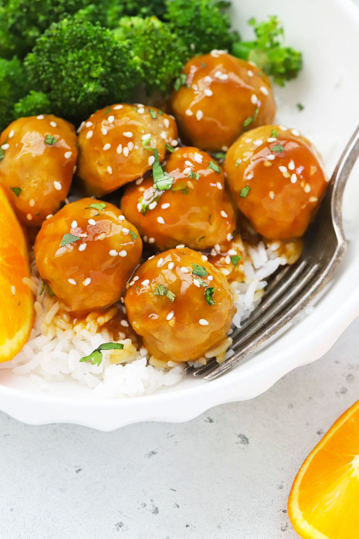 Close up view of healthy orange chicken meatballs with rice