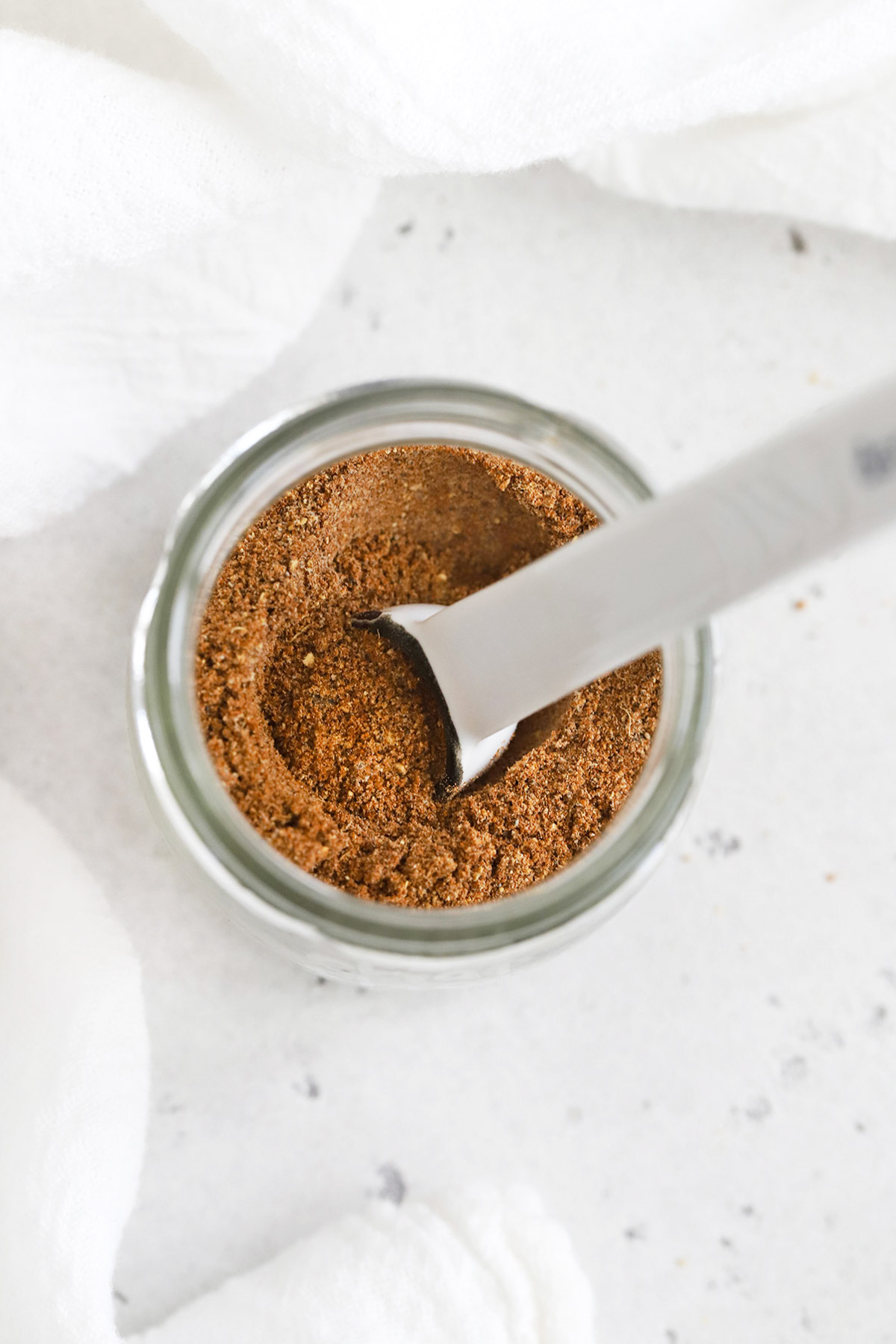 Overhead view of a jar of homemade chai spice mix
