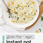 Overhead view of fluffy Instant Pot Coconut Rice garnished with toasted coconut and cilantro with text overlay that reads "gluten-free + vegan easy + fluffy instant pot coconut rice: fluffy + easy + so versatile!"