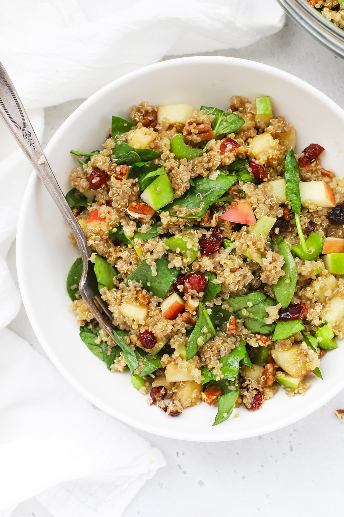 Close up verhead view of a bowl of healthy powerhouse quinoa salad with balsamic dressing