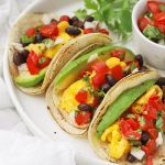 Front view of a platter of three healthy vegetarian breakfast tacos