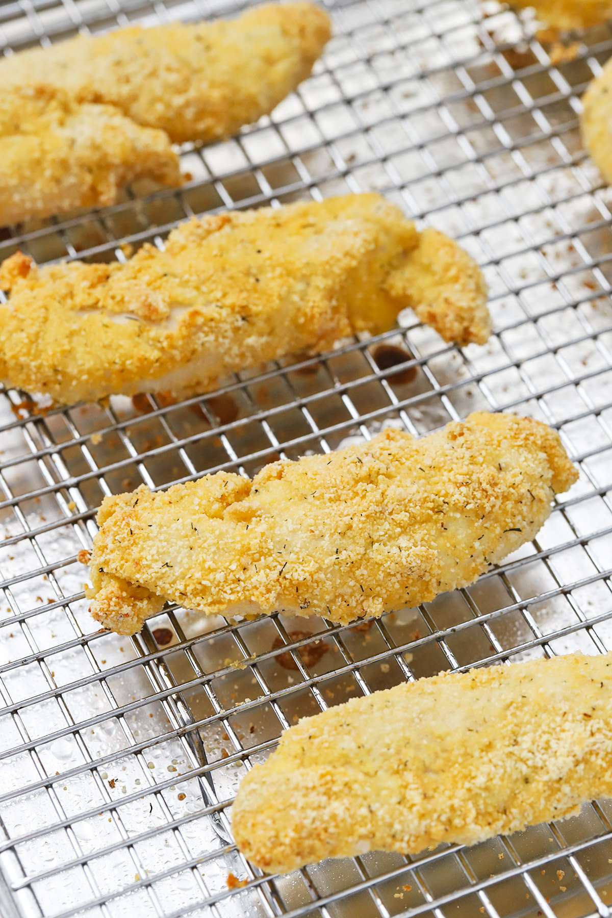 Paleo Almond Flour Chicken Tenders on a cooling rack