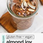 front view of almond joy overnight oats topped with almonds and coconut