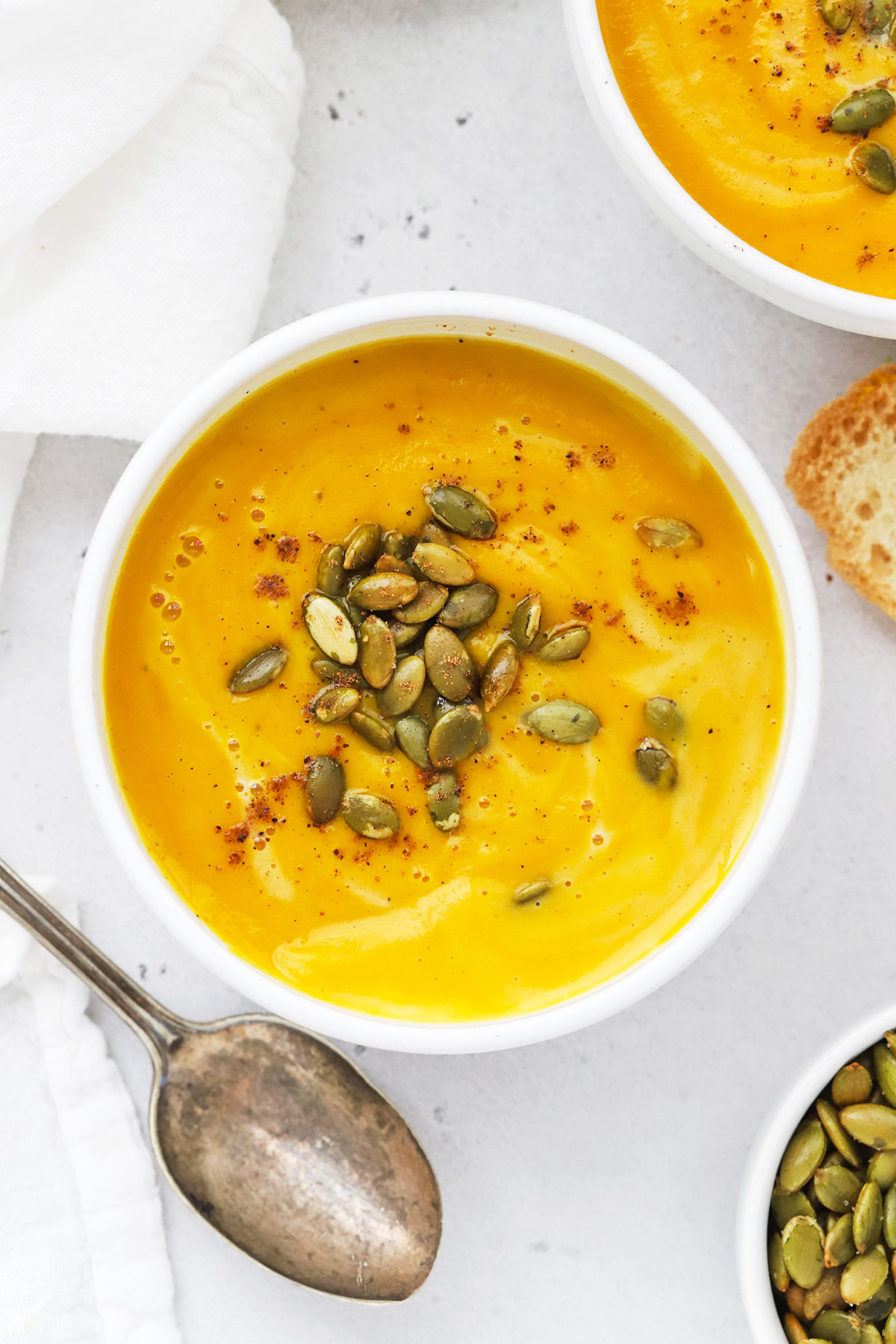 Overhead view of Panera Autumn Squash Soup Copycat in white bowls