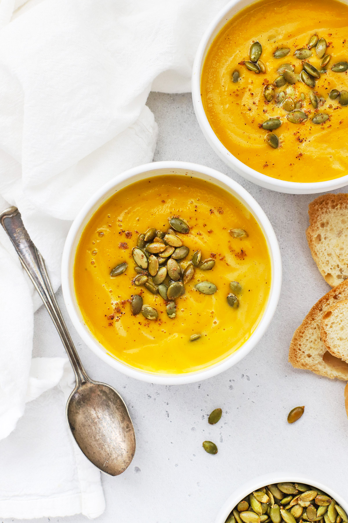 Overhead view of Panera Autumn Squash Soup Copycat in white bowls