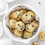 Close up view of a bowl of healthy edible cookie dough bites with chocolate chips