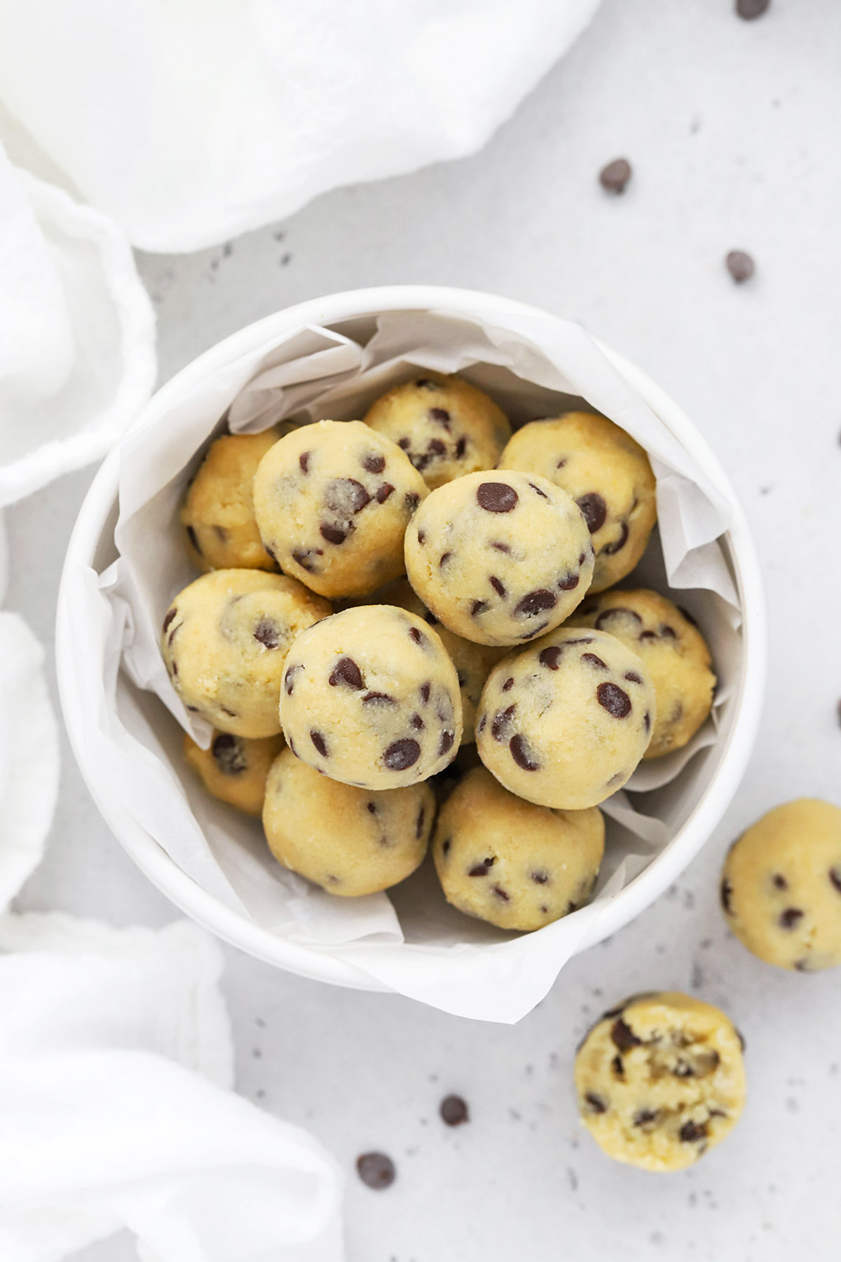 Close up view of a bowl of healthy edible cookie dough bites with chocolate chips