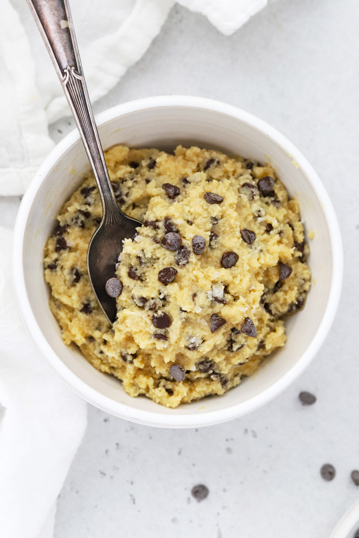 Overhead view of a bowl of healthy edible cookie dough with chocolate chips