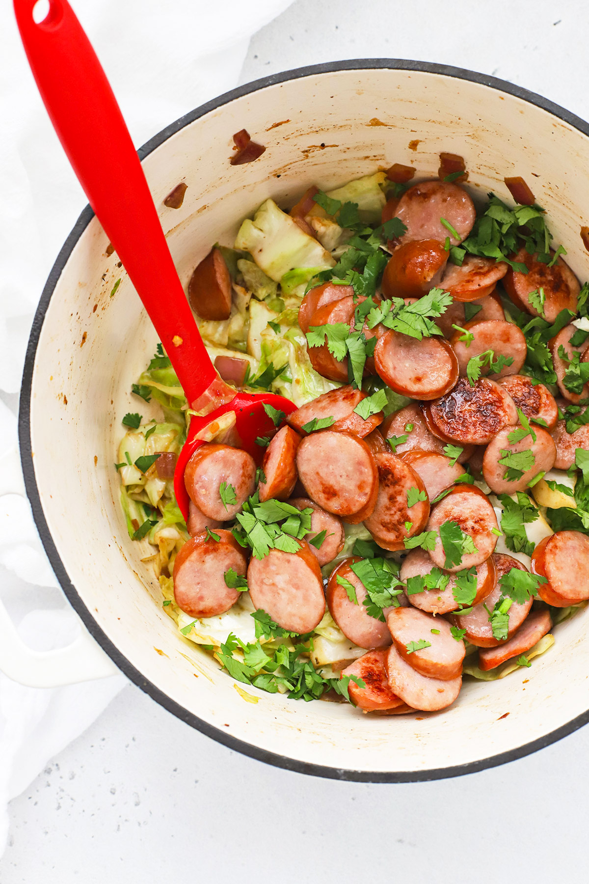 Overhead view of a one pot sausage and cabbage dinner