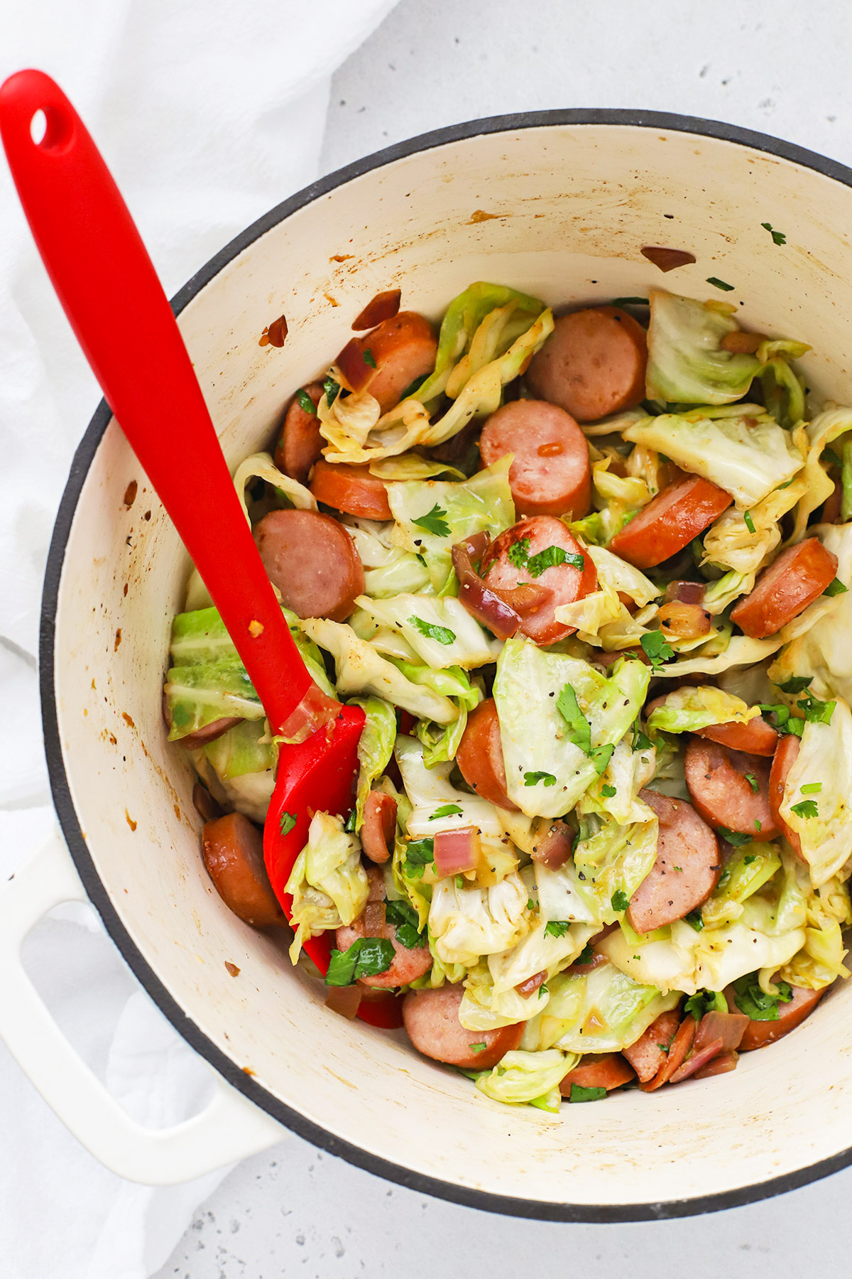 Close up Overhead view of a one pot sausage and cabbage dinner