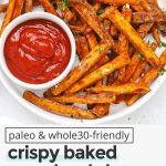 Overhead view of crispy baked sweet potato fries served with ketchup with text overlay that reads "paleo & whole30-friendly crispy baked sweet potato fries & amazing fry seasoning!"