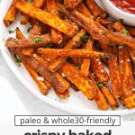 Front view of crispy baked sweet potato fries with ketchup on the side with text overlay that reads "paleo & whole30-friendly crispy baked sweet potato fries & amazing fry seasoning!"