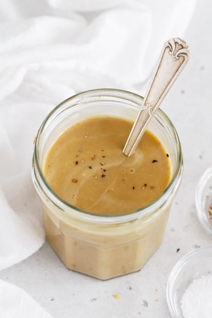 Front view of a jar of homemade honey mustard dressing for salads, wraps and more