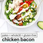 Overhead view of a bowl of chicken bacon avocado salad drizzled with paleo ranch
