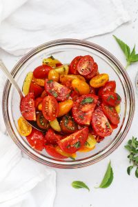Overhead view of balsamic marinated tomato salad with herbs