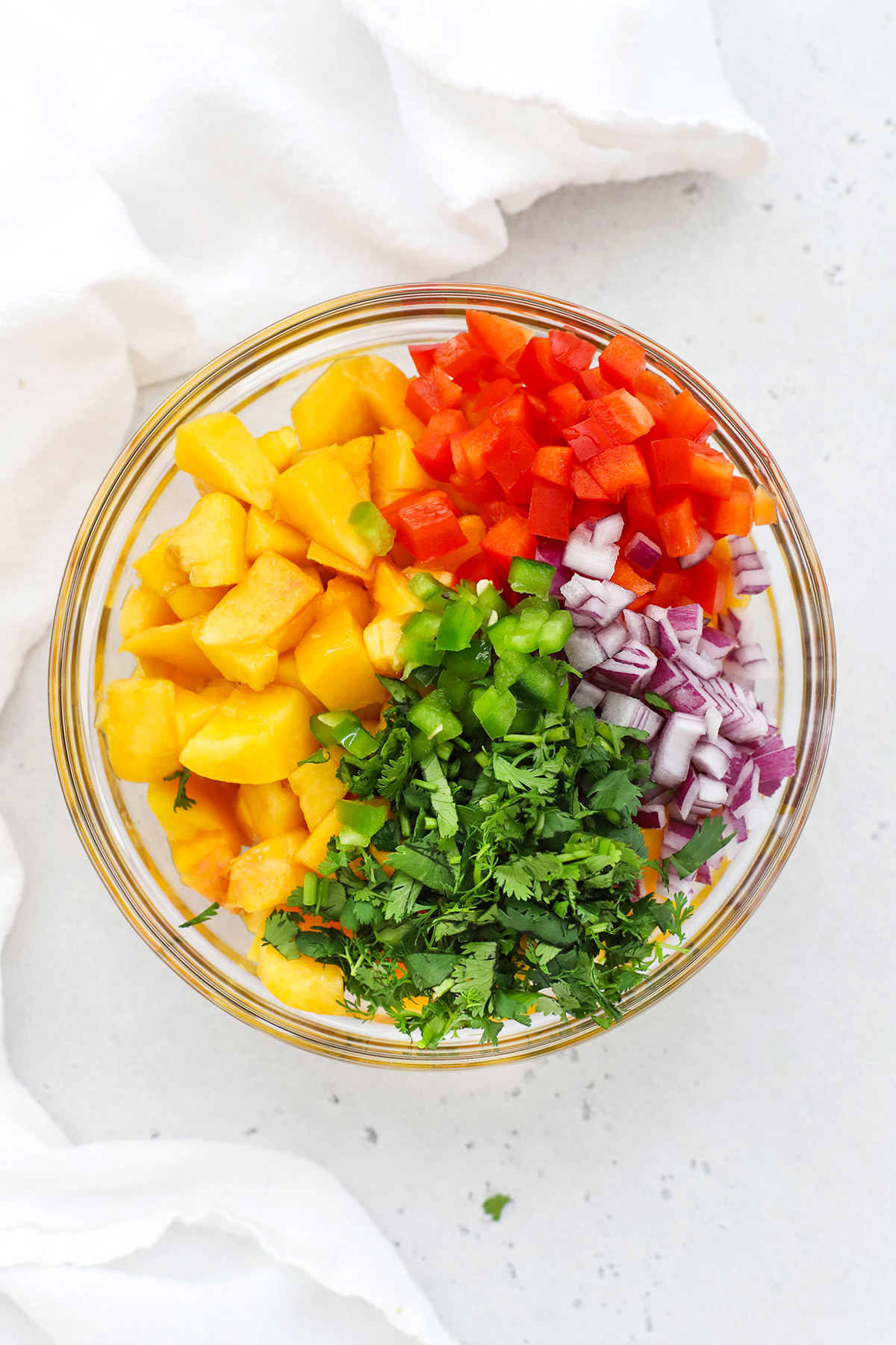 Overhead view of ingredients for peach salsa