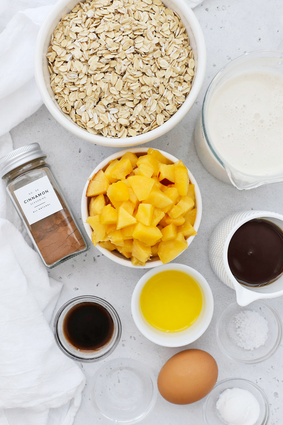 Overhead view of ingredients for gluten-free peach baked oatmeal