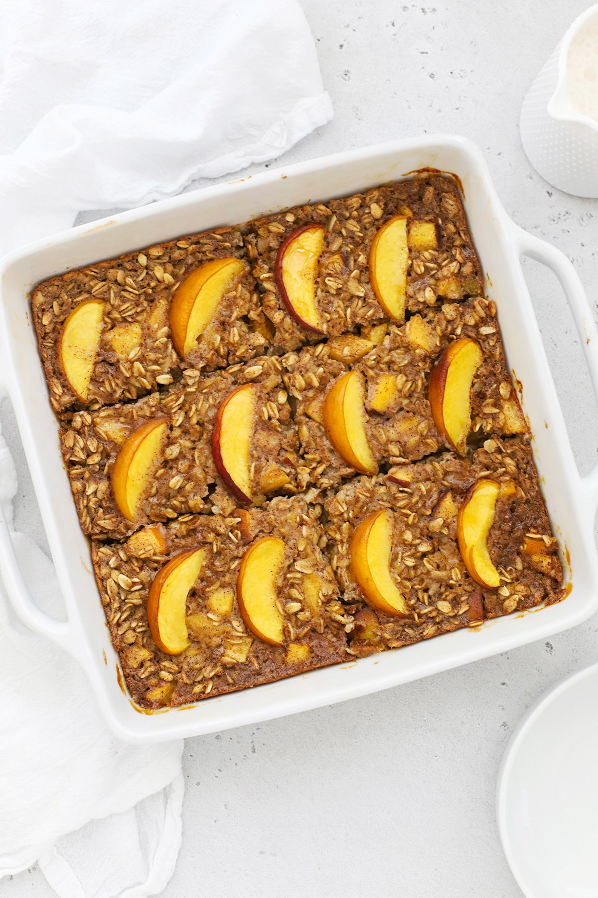 Overhead view of a pan of gluten-free peach baked oatmeal