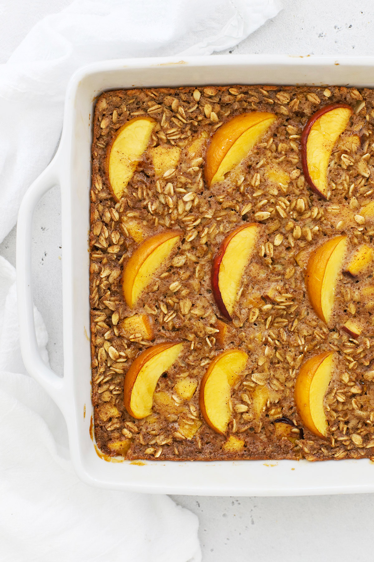 Overhead view of a pan of gluten-free peach baked oatmeal