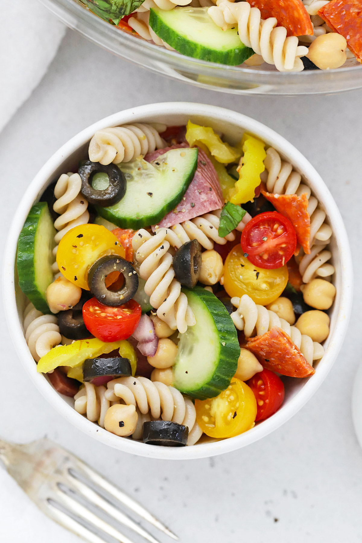 Overhead view of a bowl of gluten-free pasta salad with italian dressing