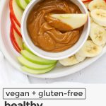 Dipping apple slices into healthy peanut butter caramel dip