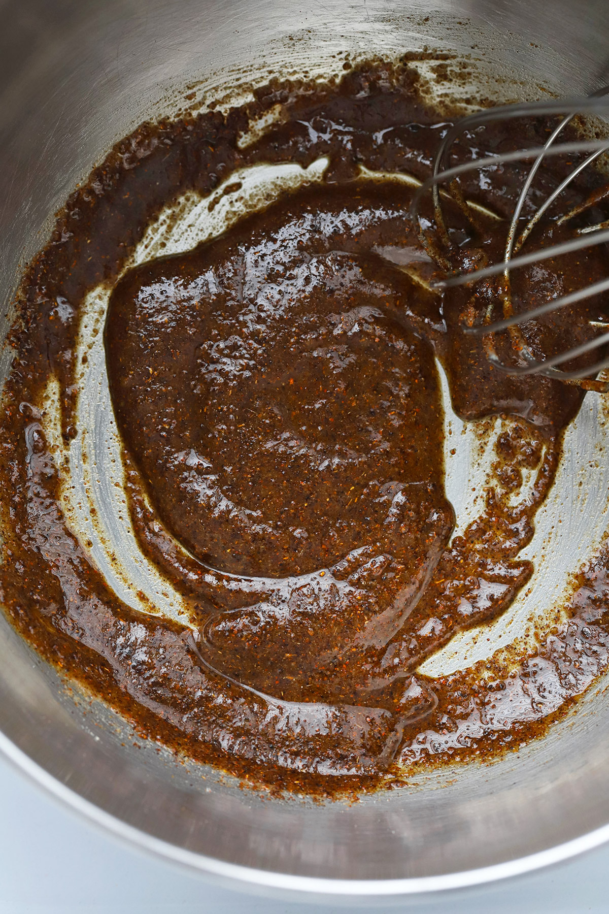 Stirring spices and roux for gluten-free enchilada sauce