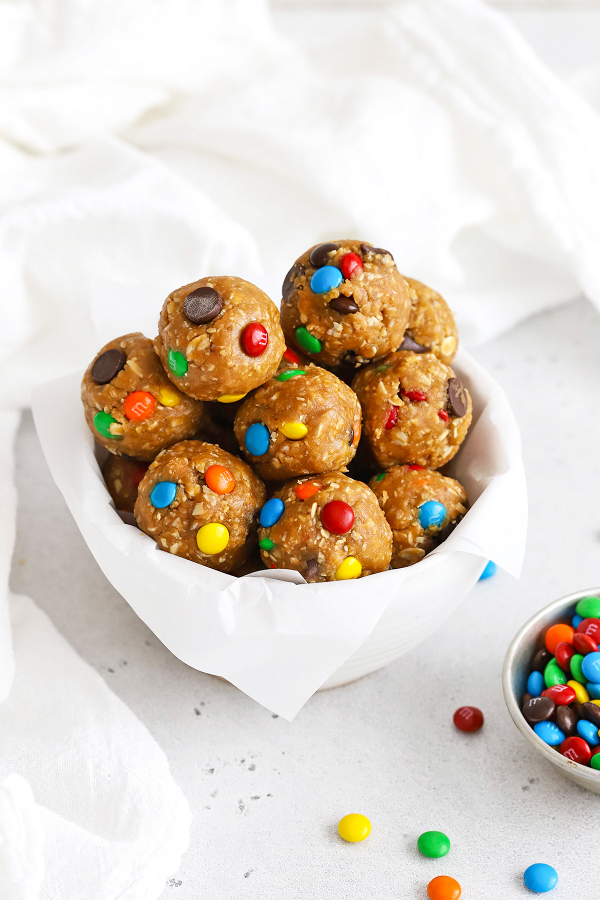 Front view of a bowl of monster cookie energy bites with mini m&ms