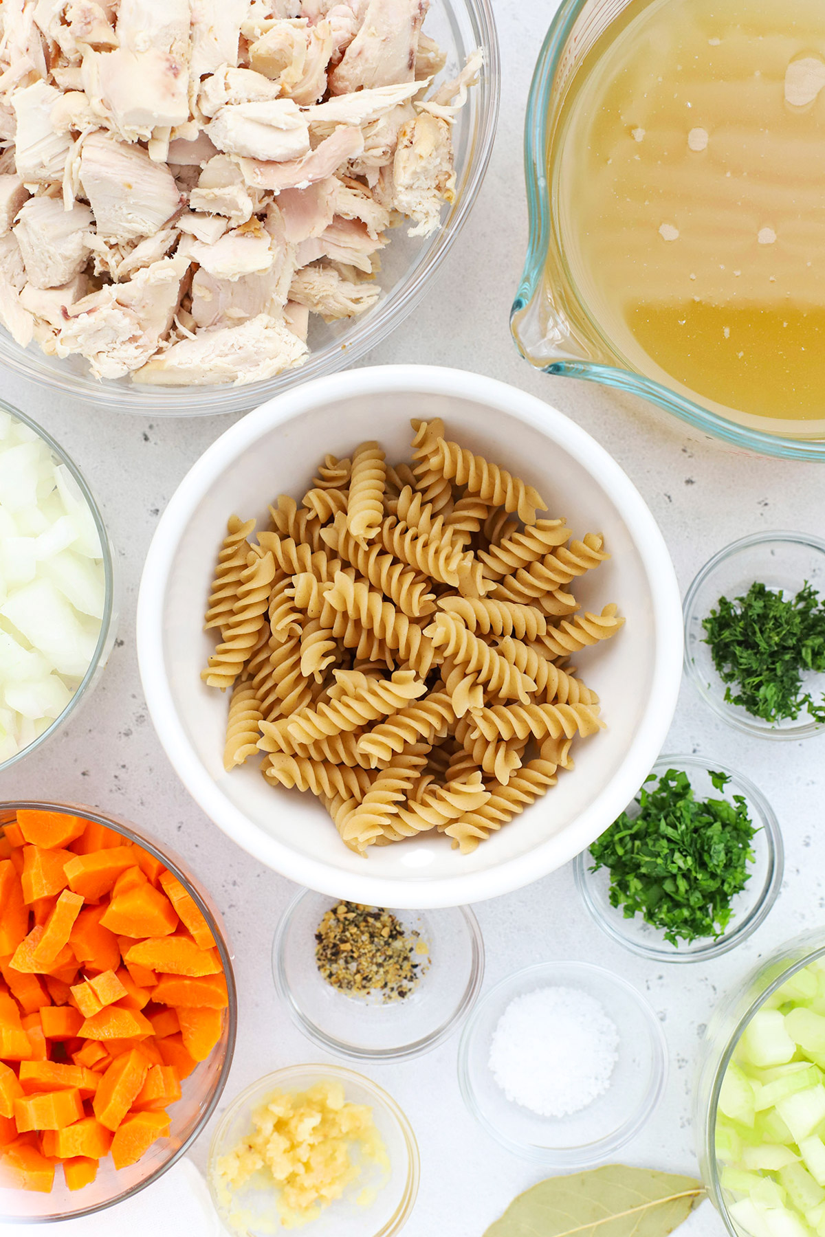 overhead view of ingredients for gluten-free chicken noodle soup