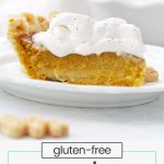 Front view of a slice of gluten-free maple pumpkin pie topped with whipped cream