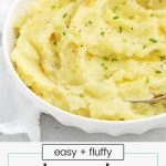 fluffy slow cooker mashed potatoes in a white bowl