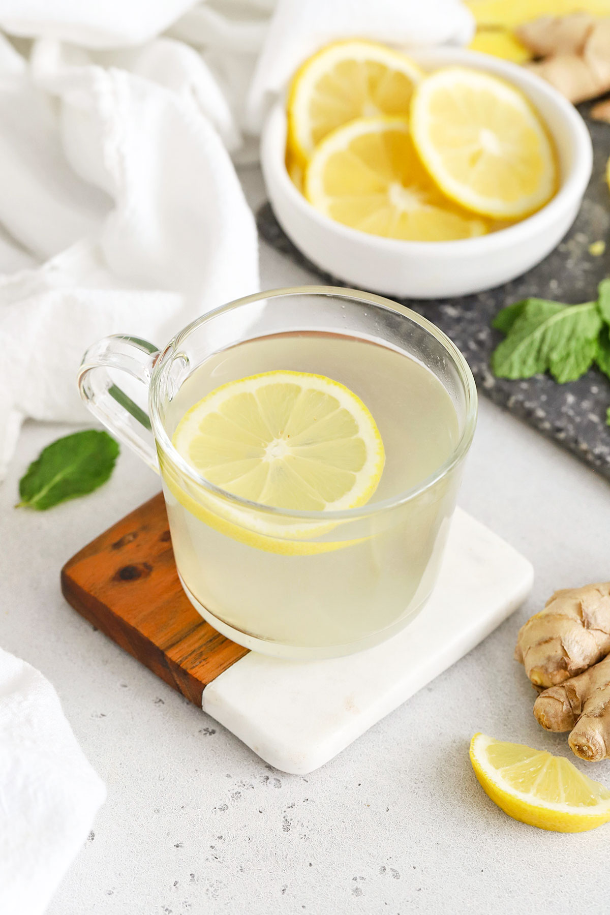 Glass mug of lemon-ginger herbal tea