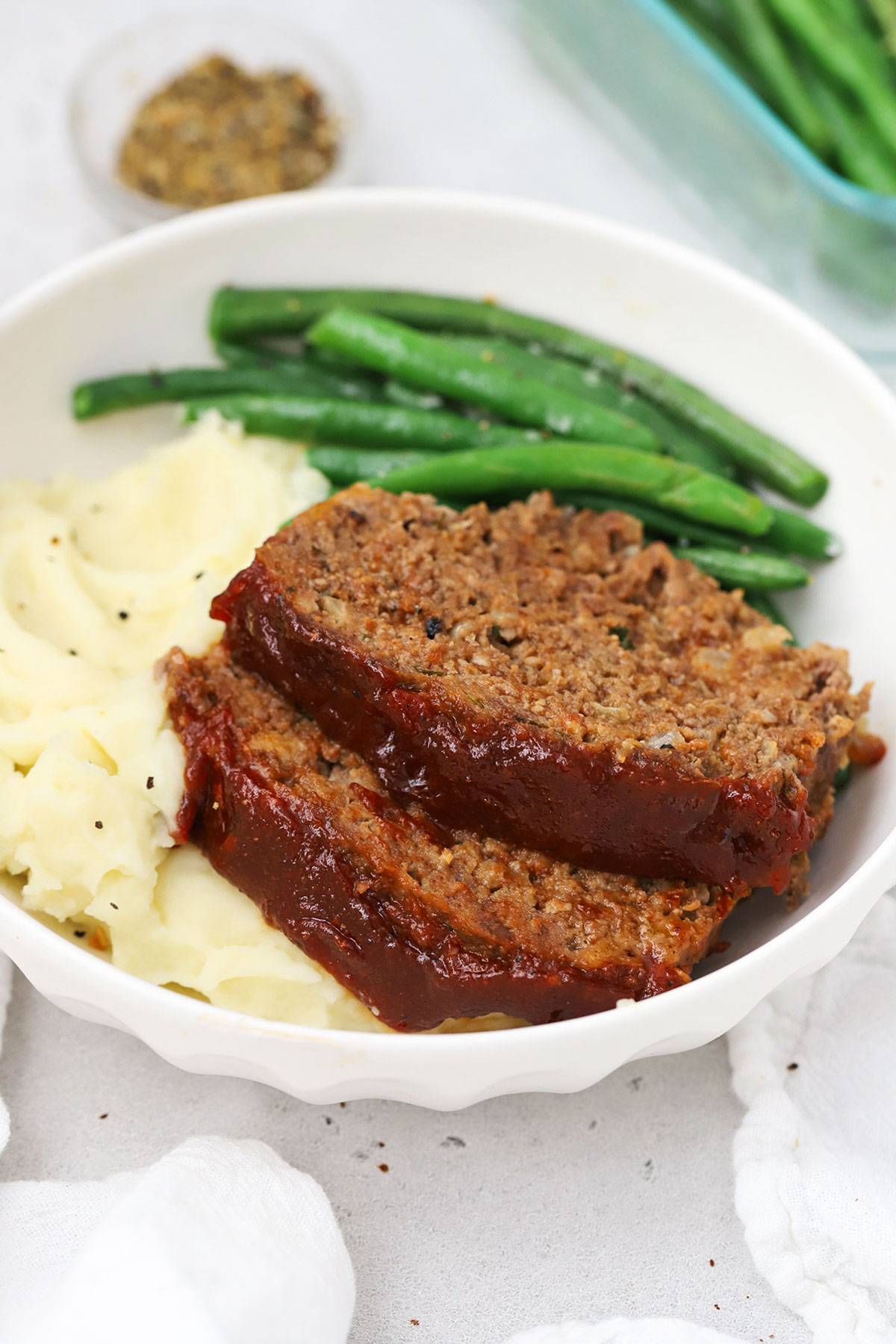 homemade meatloaf with mashed potatoes and green beans