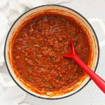 homemade gluten-free spaghetti sauce in a white Dutch oven