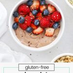 Chocolate protein yogurt bowl with fresh berries, hemp hearts, and cacao nibs