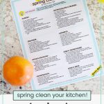 kitchen deep cleaning checklist on a counter with fresh fruit and flowers