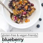 a bowl of blueberry baked oatmeal with almond milk