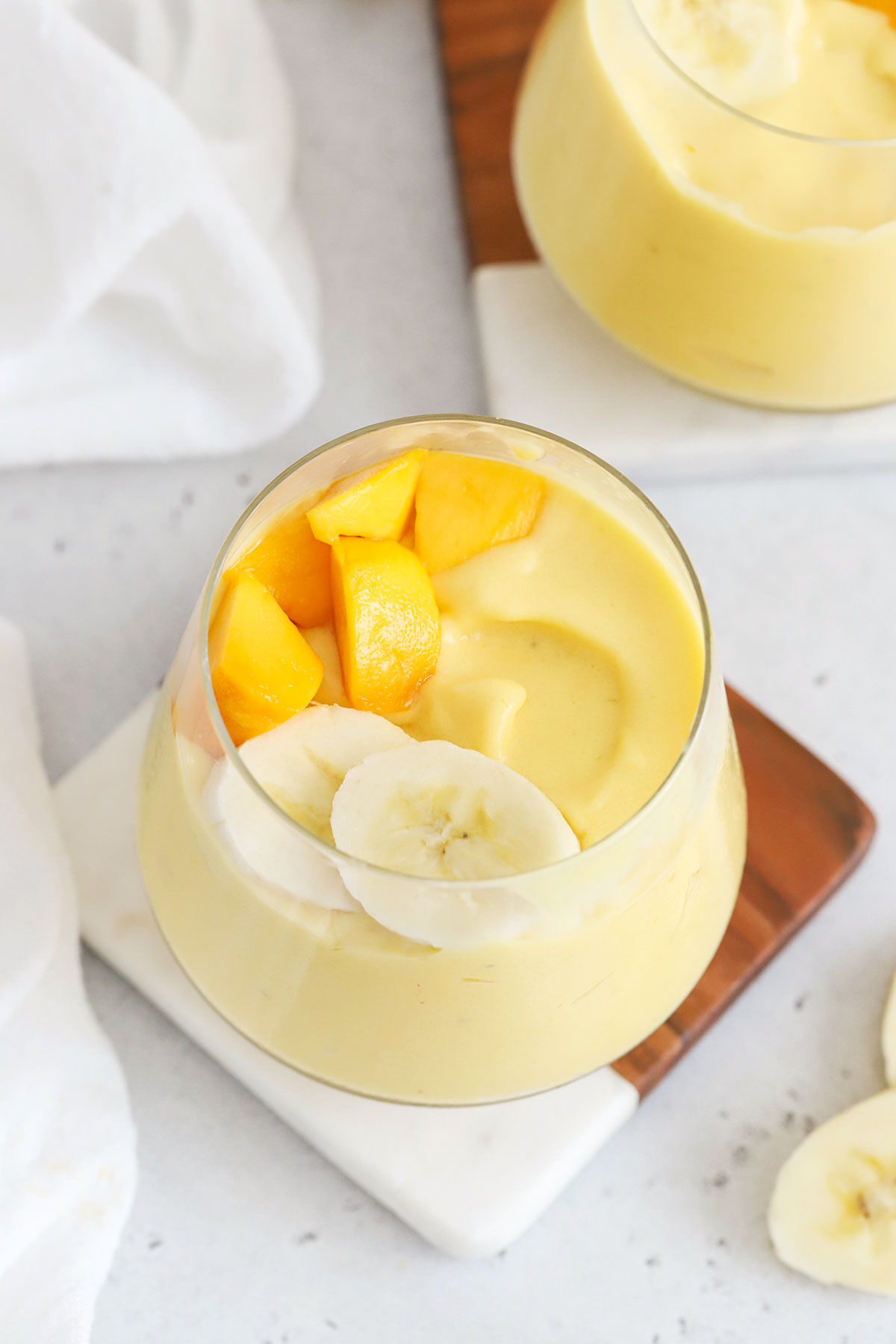 Mango banana smoothies in short glasses