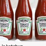 three bottles of heinz ketchup on a white background