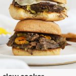 Slow cooker Italian peperoncini beef sandwiches with peperoncini stacked on a white plate