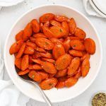 maple glazed carrots in a white bowl
