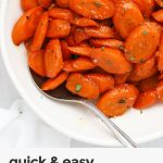 close up view of sauteed carrots with glaze in a white bowl