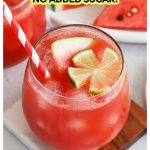 watermelon refresher mocktail in a glass with a lime flower and red and white striped straw