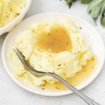 homemade gluten-free gravy spooned over mashed potatoes
