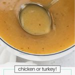 silver ladle scooping homemade gluten-free gravy from a saucepan